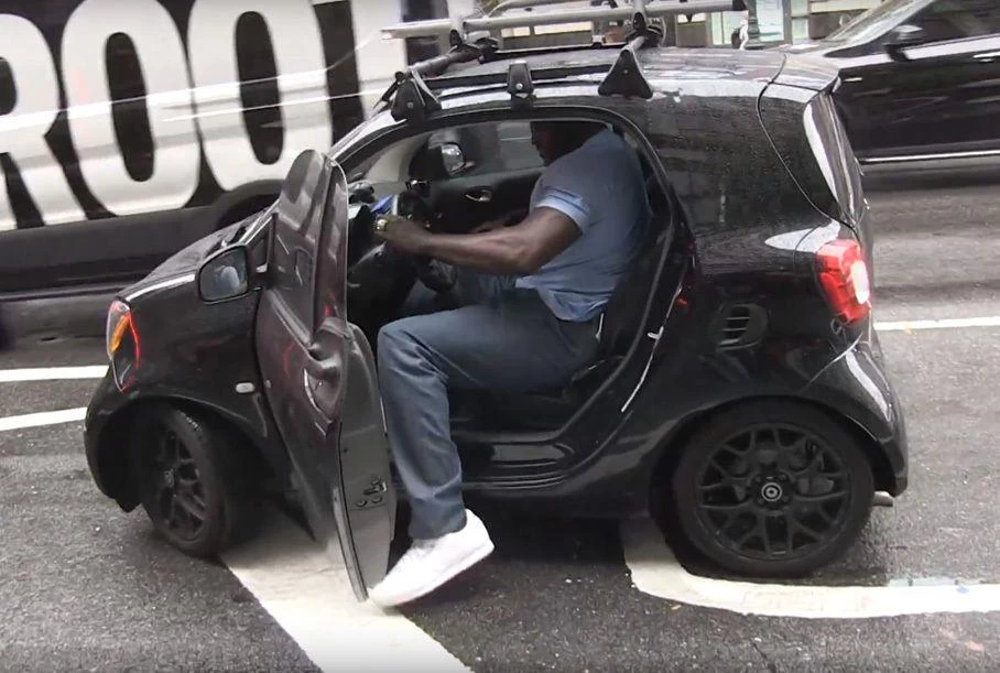 Basketball legend Shaquille O’Neal decides to ride one of the smallest cars in the world